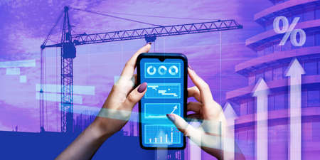 Construction crane on construction site, finished building and schedules for implementation of...