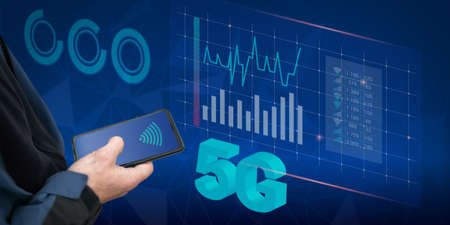Programmers hand with a smartphone, traffic download speed charts. The concept of remote monitoring,...
