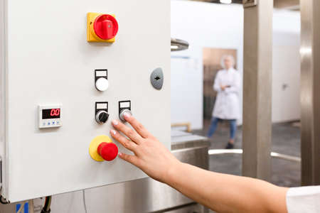 View of operation panel and product inspection monitoring display. Bread production line in bakery....