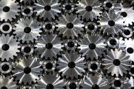Metalworking. Industrial background. Steel gears in sulfofresol feed after metalworking on a CNC machineの写真素材