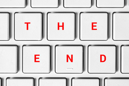 THE END is the inscription on the computer keyboard. The concept of ending, stopping, ending work, streaming, chatting, graduation.の写真素材