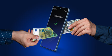 mobile banking. Online transfers, exchange, payment systems. A hand puts euros into a smartphone and...