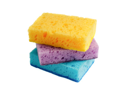 Cleaning, housework. Yellow, blue and purple sponges for washing dishes and other household chores.の写真素材