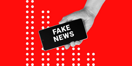 Deception, Politics, Propaganda. A hand holds a smartphone with the inscription FAKE NEWS on a red background. Minimalist art collageの写真素材