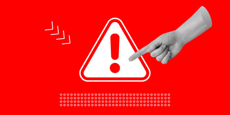 Attention concept. A hand points to a danger warning sign with a red exclamation mark. Minimalist...