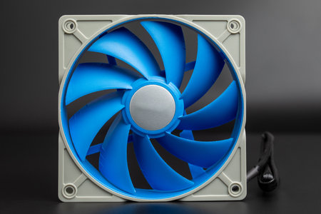 PC's performance. Blue-gray computer cooler set against a black background for custom PC builds, efficiency with aesthetic appeal. Upgrade system with advanced hardware for silent, high-performance operationの写真素材