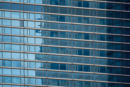 Architectural background. Fragment of the building facade with blue glazing. Diagonal arrangement