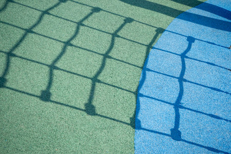Playground flooring with rubber coating and geometric patterns. Safe surface for childrens...