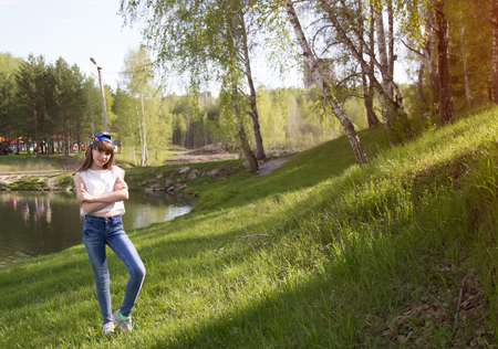 Outdoors portrait of beautiful young girl. Portrait of Teenage girl near birch tree.の写真素材
