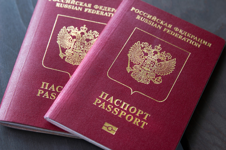 Two passports on a dark background, closeup.の写真素材
