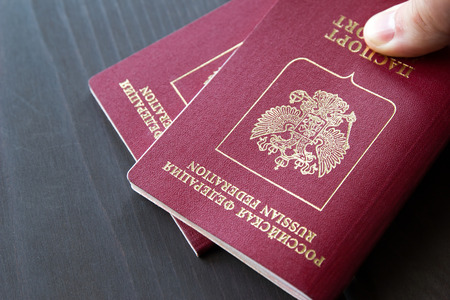 Two passports on a grey neutral background, closeup.の写真素材