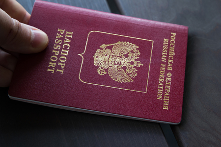 Closeup of man holding passports on passport control. Travel conceptの写真素材