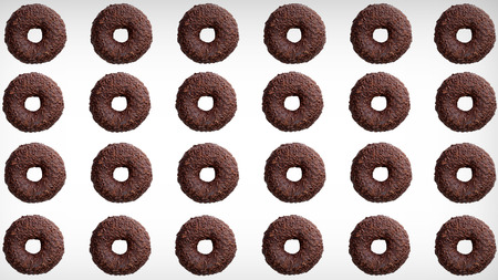 Background of a few delicious donuts covered with chocolateの写真素材