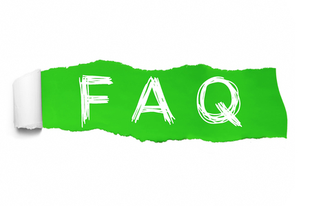 The word FAQ appearing behind green torn paper.の写真素材