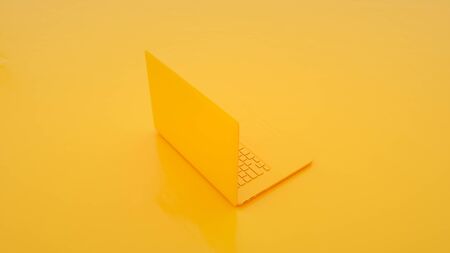 Yellow Laptop on yellow background. 3d illustration.の写真素材