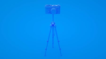 Photo studio concept. Camera and tripod on blue background. 3d illustrationの写真素材