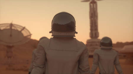 Three Astronauts in Space Suits Confidently Walking on Mars. Mars Colonization Concept. 3d renderingの写真素材