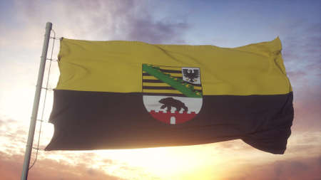 Saxony-Anhalt flag, Germany, waving in the wind, sky and sun background. 3d renderingの写真素材