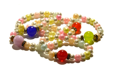Pearl bracelets  Bracelets made of artificial pearls with large, colorful beads  Photo taken on a white backgroundの写真素材