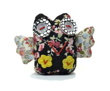 Little owl from fabric. The owl from pieces of cloth on a white backgroundの写真素材