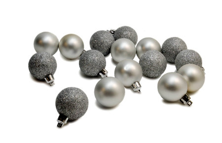Christmas ornaments. Silver balls. Balls and glass and is sprinkled with silver baby. Photo on a white background.の写真素材