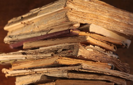 A stack of old yellowed books closeupの写真素材
