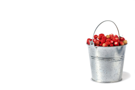 Small bucket full of strawberries isolated on white backgroundの写真素材