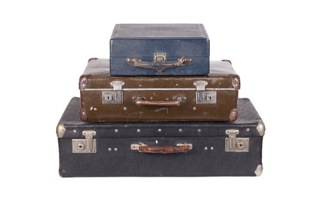 A stack of old suitcases isolated on a white backgroundの写真素材