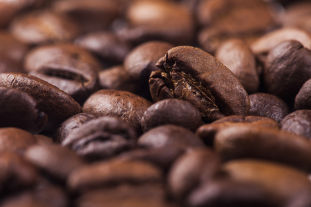 Closeup of coffee beans with focus on oneの写真素材