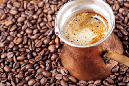 Coffee beans, vintage copper turkish coffee pot, cezve or ibrikの写真素材