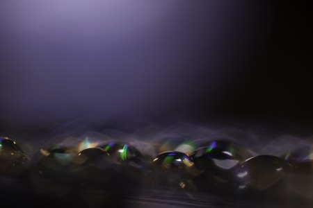 Abstract blurred rainbow water drops close up