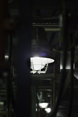 closeup lantern lights metal construction of factoryの写真素材