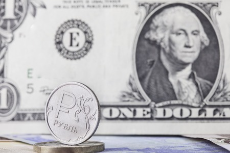 coin ruble on the background bills dollar and Euro closeupの写真素材