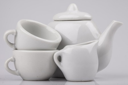 a set of ceramic ware on a white background