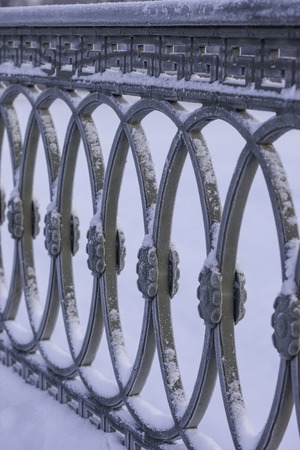 the cast iron railings of the bridge, Saint-Petersburg, Russia, winter photosの写真素材