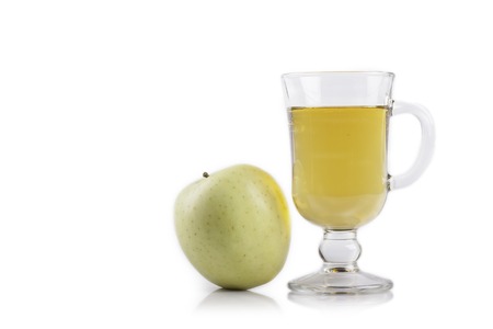 green Apple and glass of juice isolated on white closeupの写真素材
