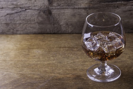 cognac in a glass with ice close up