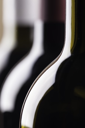 silhouettes of the bottles close up on black buckgroundの写真素材
