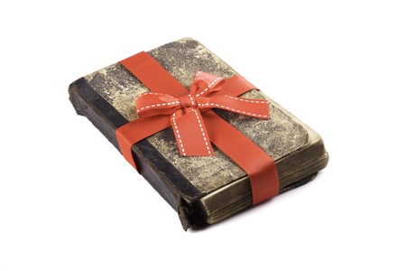 old vintage the book in a gift ribbon closeupの写真素材