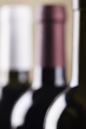 the silhouettes of wine bottles close upの写真素材