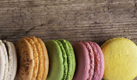 macaroons close up on the old wooden Board vintage backgroundの写真素材