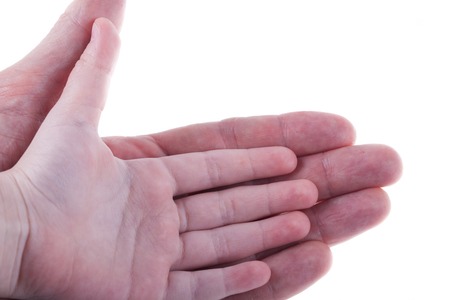 palm of child hand on the palm of an adult man isolated on whiteの写真素材