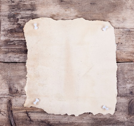 vintage empty paper blank on wooden backgroundの写真素材