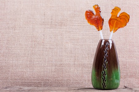 candy lollipop closeup on a brown backgroundの写真素材