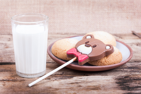 Chocolate, chip cookies and milk onrustic wood backgroundの写真素材