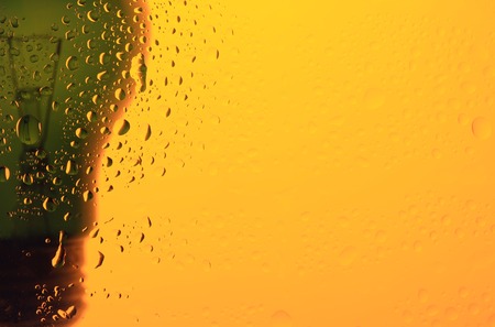 abstract light bulb closeup on yellow background wetの写真素材