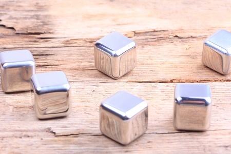abstract background. steel cubes closeup on a wooden surfaceの写真素材