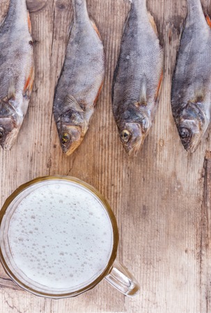 beer and fish on the table top view backgroundの写真素材