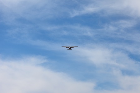 small propeller aircraft in the blue sky