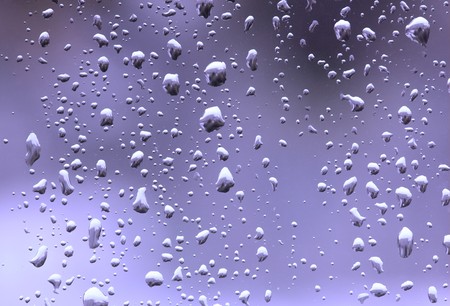 abstruct drops of rain on a window glass